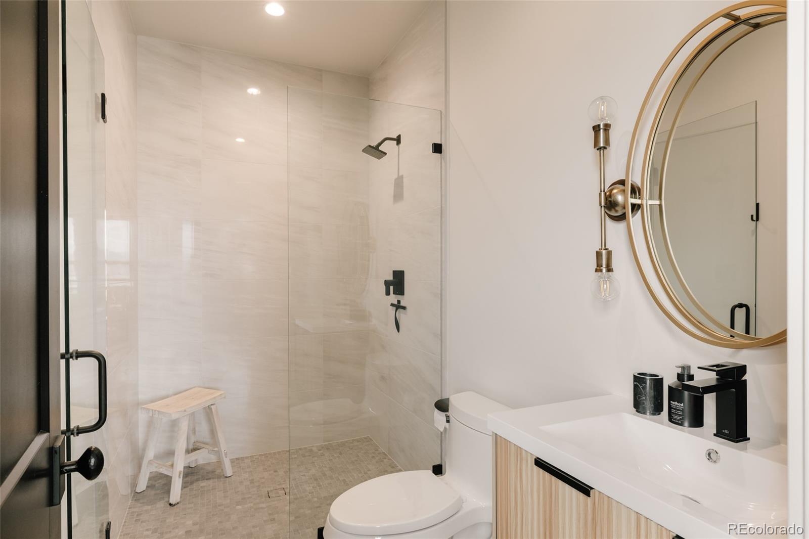 2531 Southwind Road Berthoud, CO 80513 - Photo 21 of 49 a bathroom with a sink toilet and shower