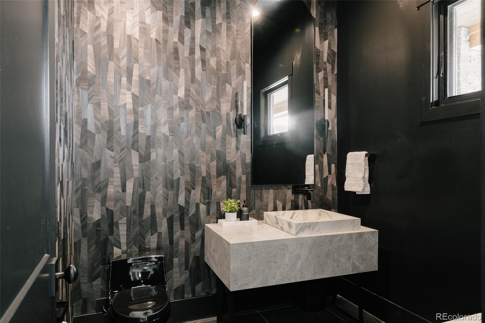 2531 Southwind Road Berthoud, CO 80513 - Photo 23 of 49 a bathroom with a sink vanity and mirror