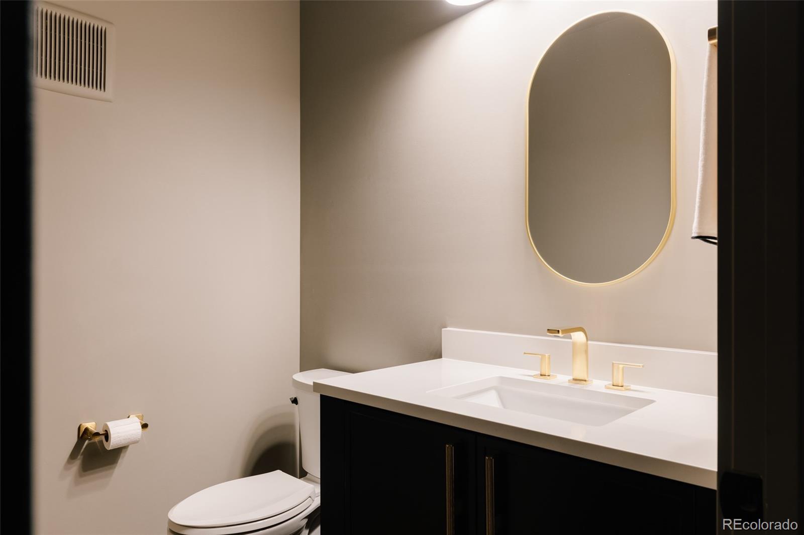 2531 Southwind Road Berthoud, CO 80513 - Photo 27 of 49 a bathroom with a sink vanity mirror and toilet