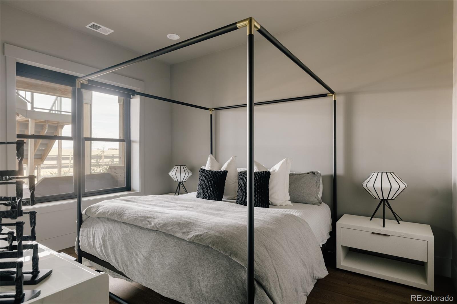 2531 Southwind Road Berthoud, CO 80513 - Photo 29 of 49 a bedroom with double bed and a window