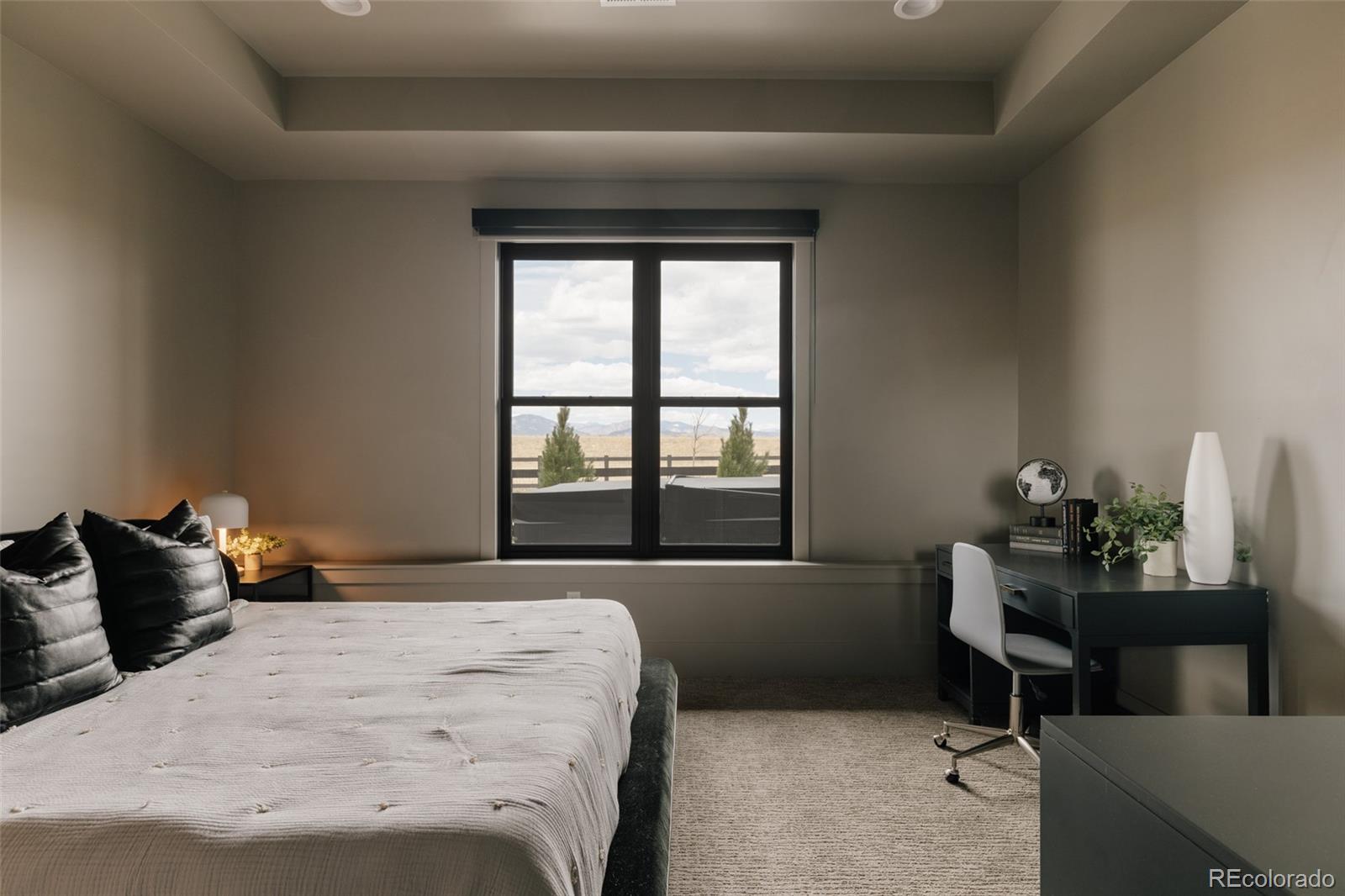 2531 Southwind Road Berthoud, CO 80513 - Photo 31 of 49 a bedroom with a bed and a window