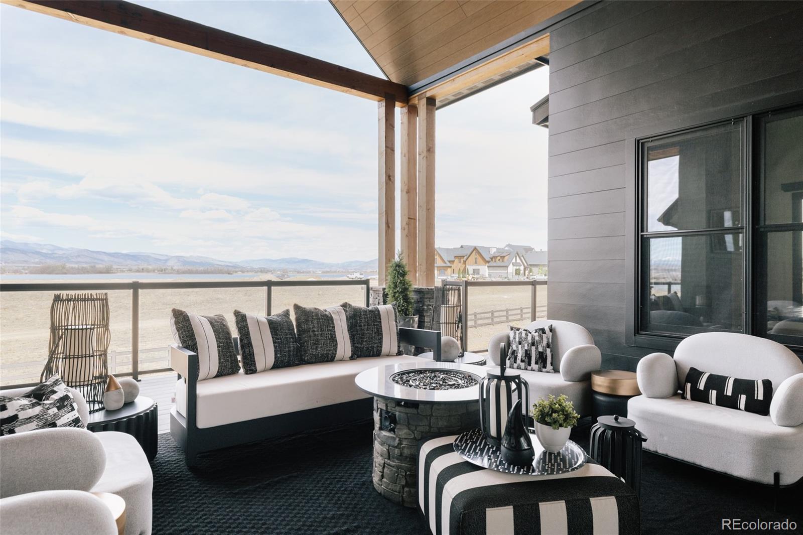 2531 Southwind Road Berthoud, CO 80513 - Photo 35 of 49 a balcony with furniture and a floor to ceiling window