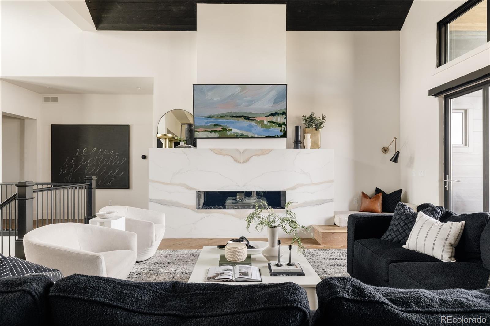2531 Southwind Road Berthoud, CO 80513 - Photo 4 of 49 a living room with furniture and a flat screen tv