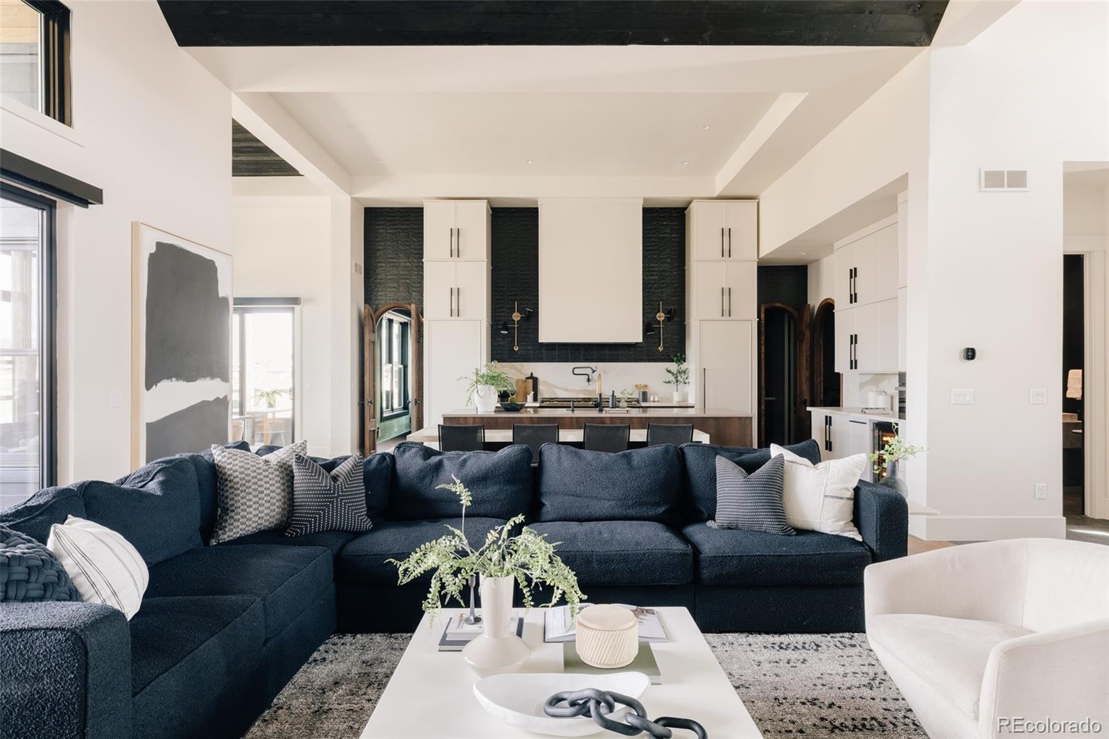 2531 Southwind Road Berthoud, CO 80513 - Photo 5 of 49 a living room with furniture and a large mirror