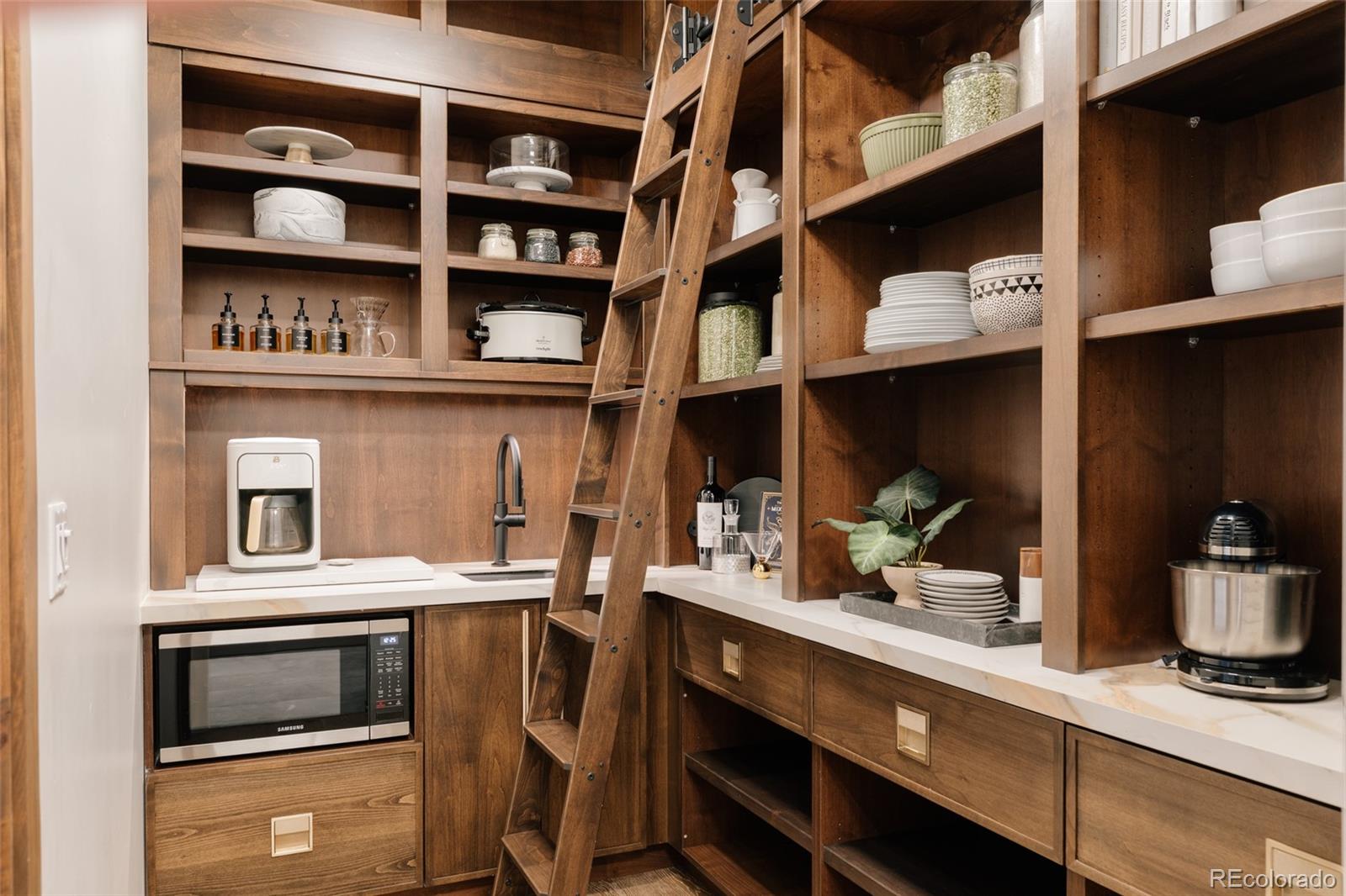 2531 Southwind Road Berthoud, CO 80513 - Photo 10 of 49 a kitchen with stainless steel appliances and cabinets