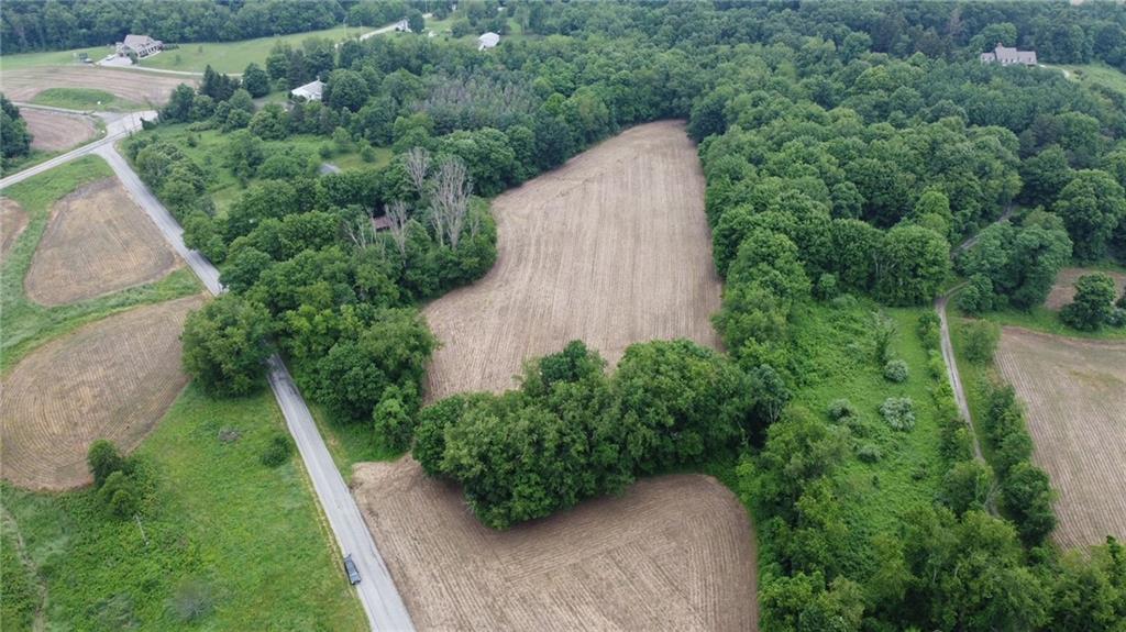 an aerial view of a house with pool