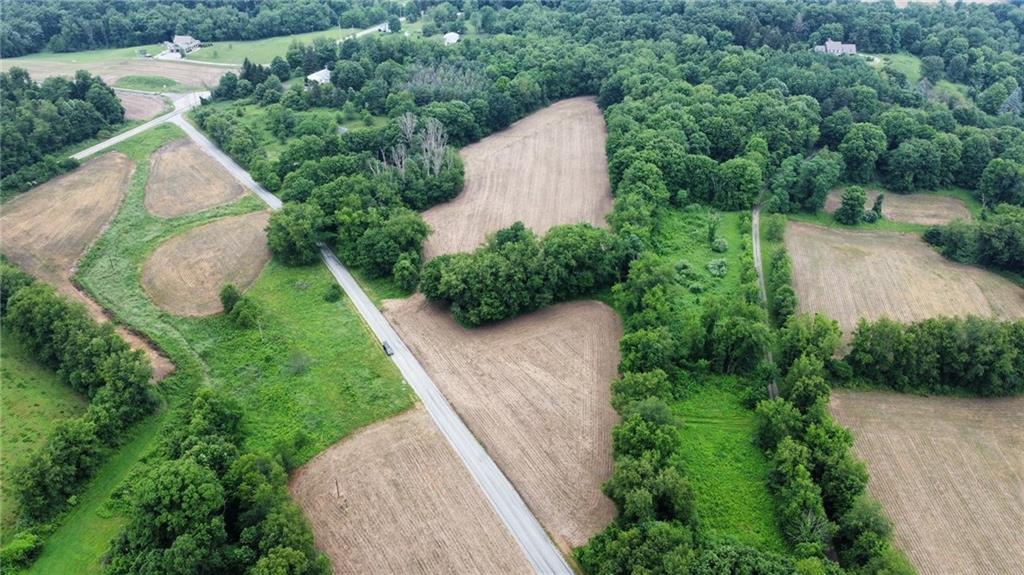 0 Mccloy Road Beaver Falls, PA 15010 - Photo 2 of 6 an aerial view of a house with a yard and covered with trees
