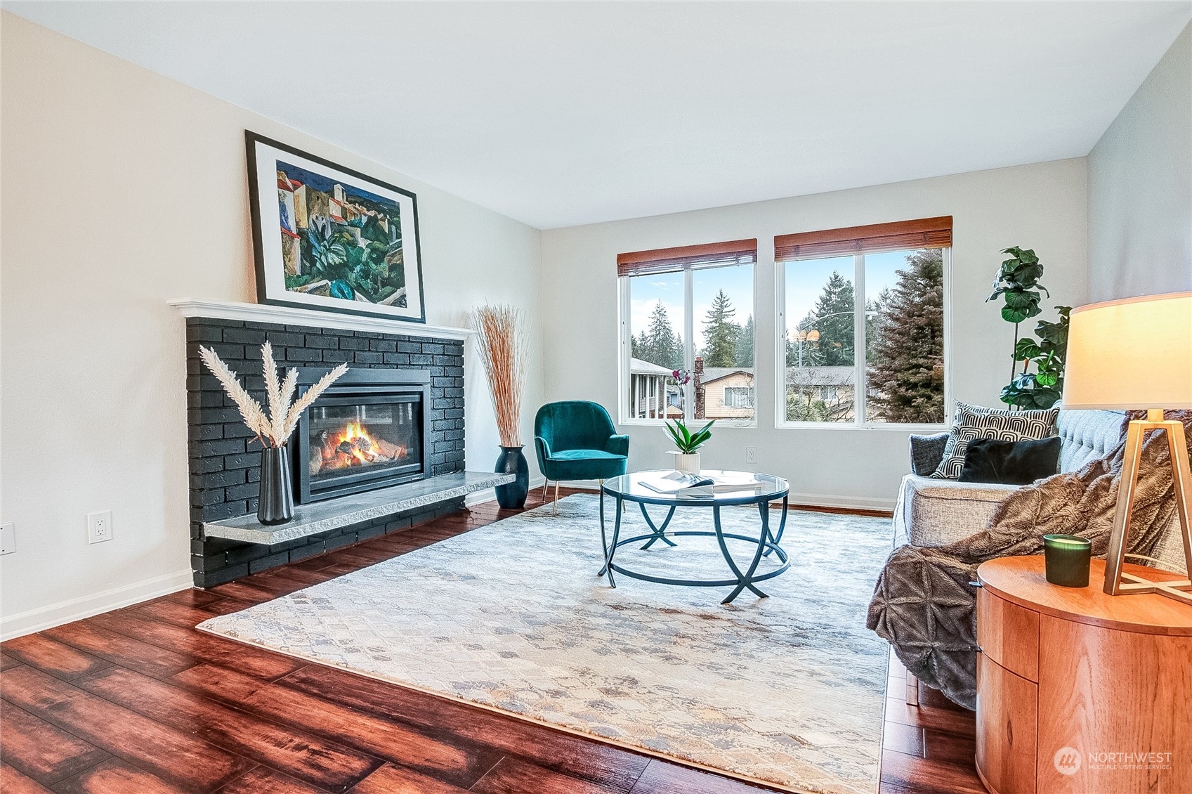 11820 Northeast 158th Street Bothell, WA 98011 - Photo 3 of 28 a living room with furniture a rug and a fireplace