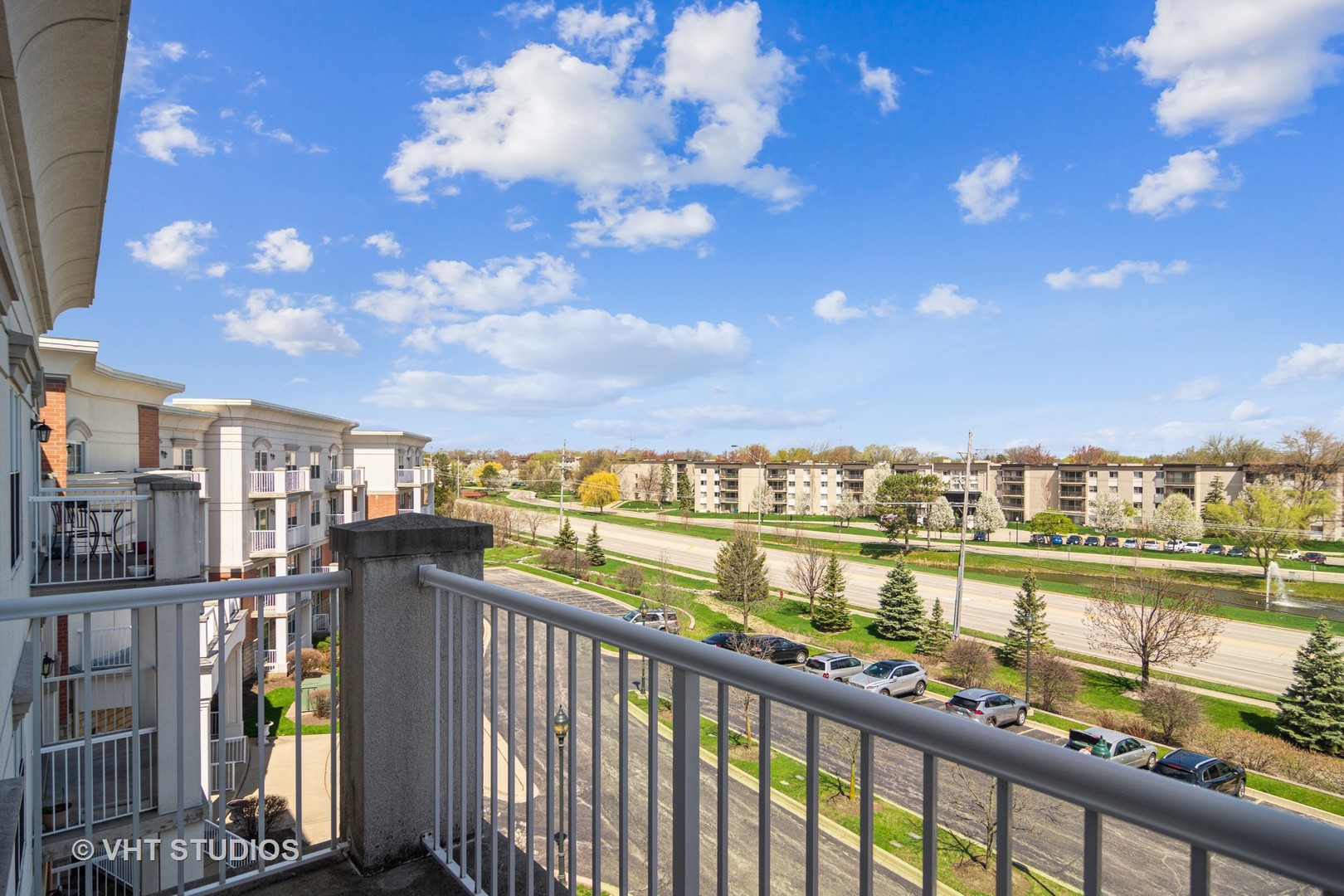 701 West Rand Road, Unit 423 Arlington Heights, IL 60004 - Photo 14 of 15 a view of a city skyline from a balcony