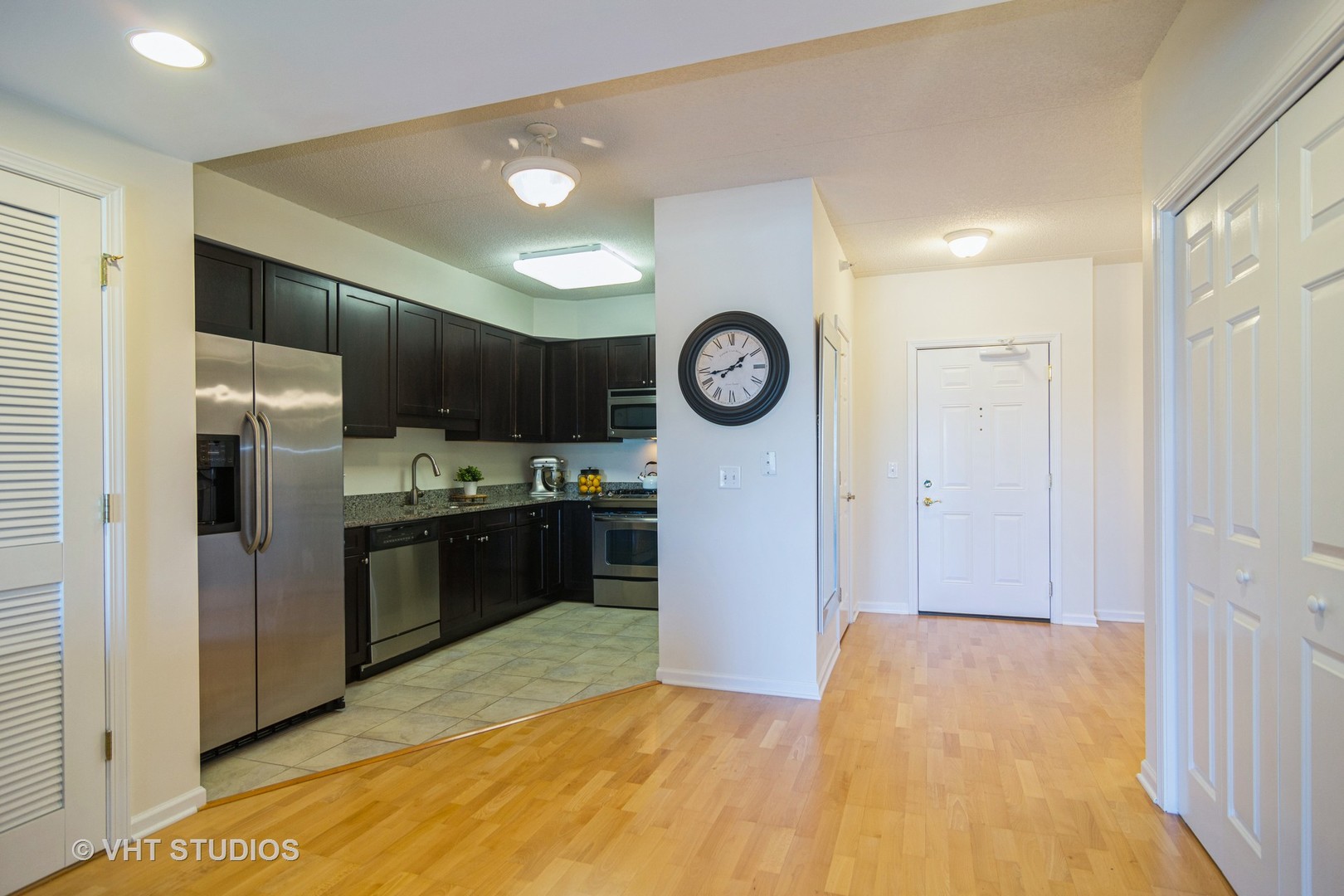 701 West Rand Road, Unit 423 Arlington Heights, IL 60004 - Photo 6 of 15 a kitchen with stainless steel appliances a refrigerator and a stove