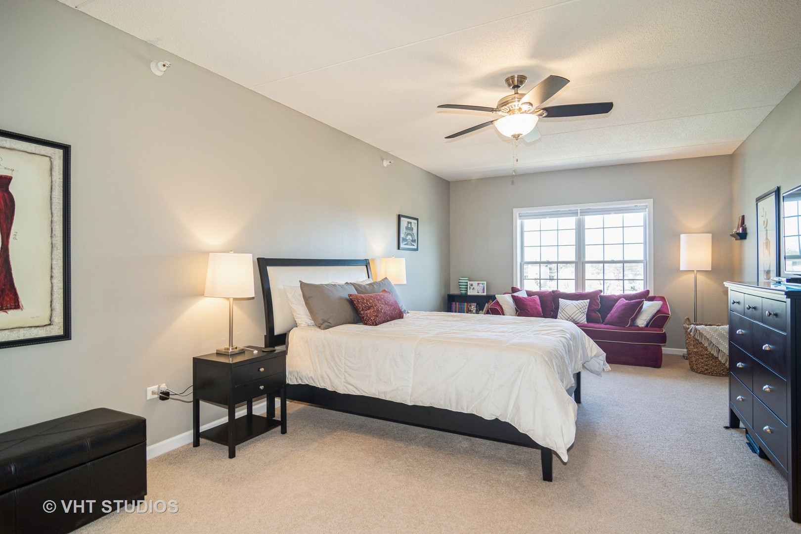 701 West Rand Road, Unit 423 Arlington Heights, IL 60004 - Photo 8 of 15 a bedroom with bed window and couch