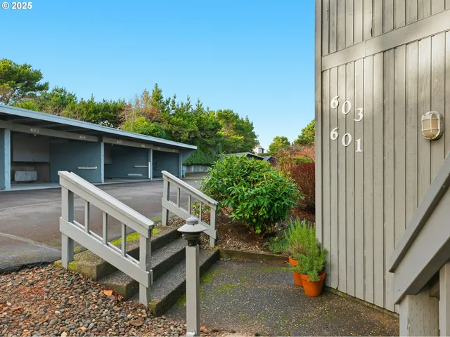 a view of house with deck and outdoor space