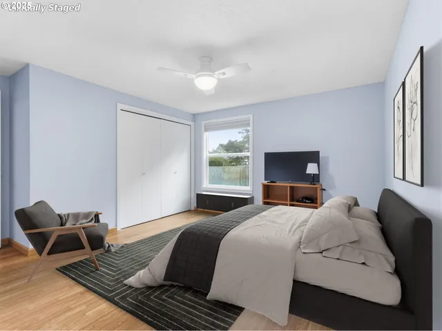 a bedroom with a bed and a dresser