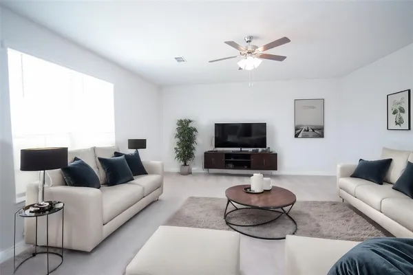 a bathroom with a bathtub shower sink vanity and toilet