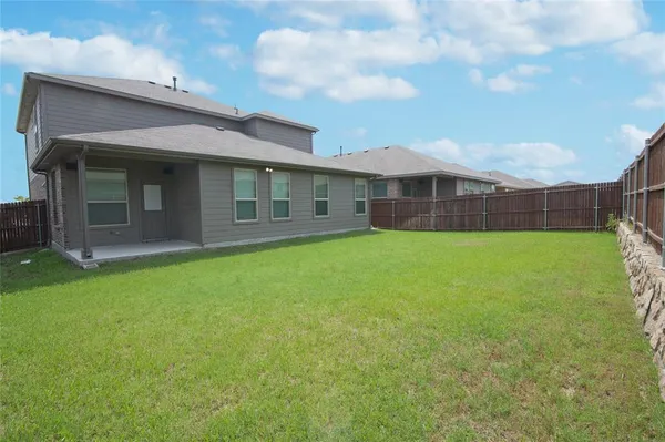 a view of a swimming pool with a table and chairs