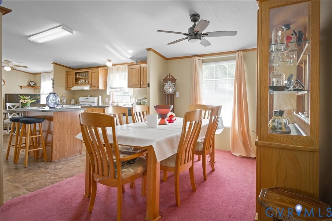 23344 Booth Road Stony Creek, VA 23882 - Photo 11 of 45 a dining room with furniture window and wooden floor