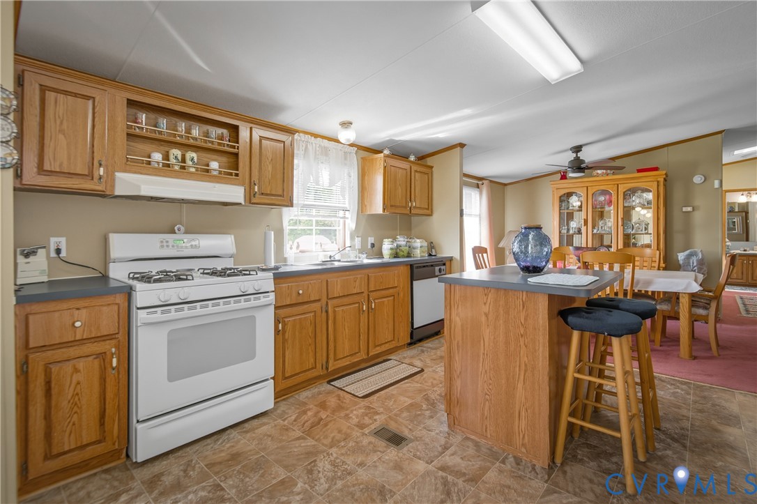 23344 Booth Road Stony Creek, VA 23882 - Photo 15 of 45 a kitchen that has a lot of cabinets in it and appliances