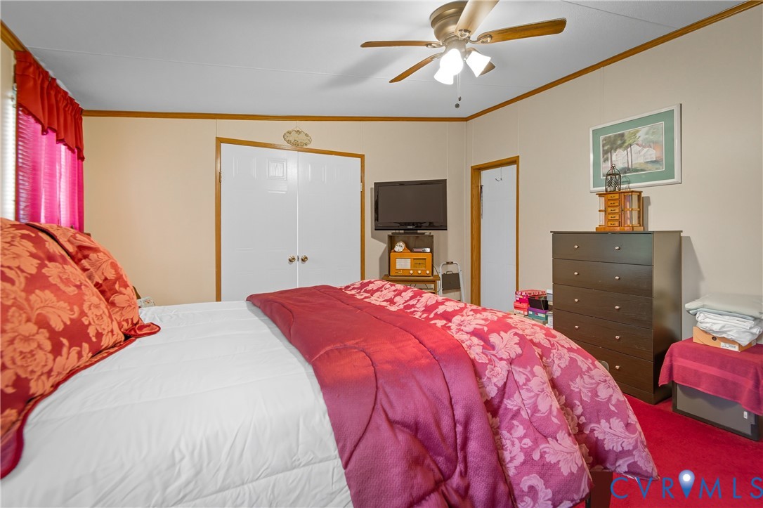 23344 Booth Road Stony Creek, VA 23882 - Photo 26 of 45 a bedroom with a bed and a dresser