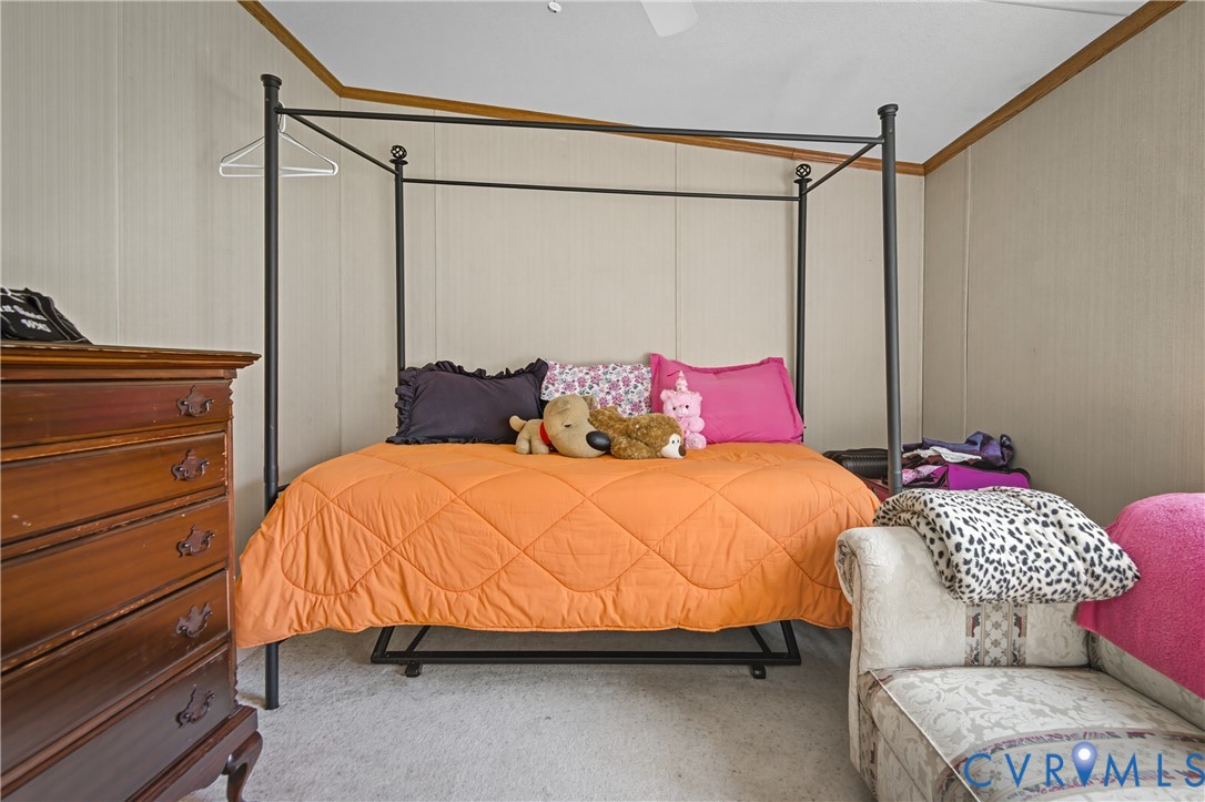 23344 Booth Road Stony Creek, VA 23882 - Photo 33 of 45 a bedroom with a bed and a dresser