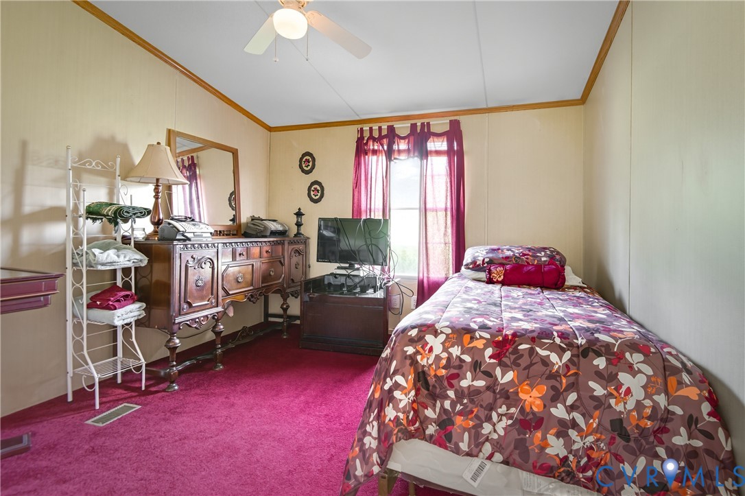 23344 Booth Road Stony Creek, VA 23882 - Photo 37 of 45 a bed room with a bed and a window