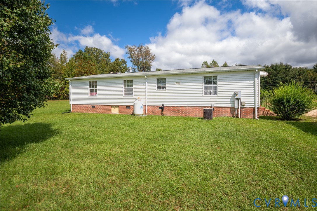 23344 Booth Road Stony Creek, VA 23882 - Photo 41 of 45 a front view of house with yard and green space
