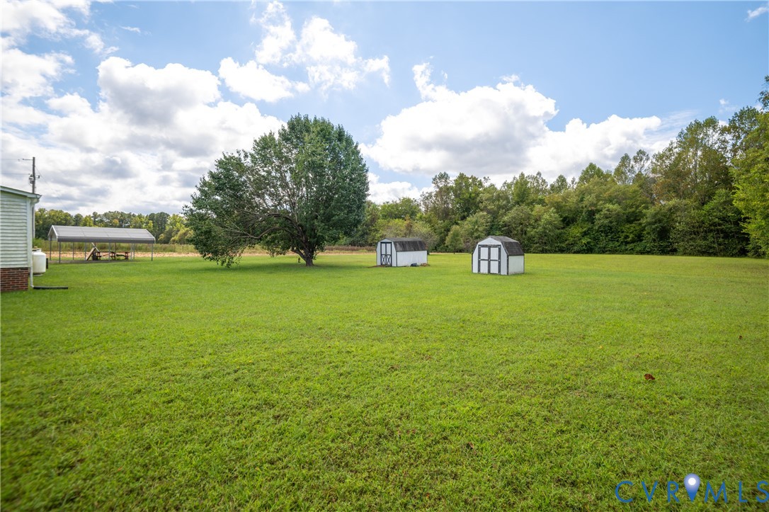 23344 Booth Road Stony Creek, VA 23882 - Photo 44 of 45 a view of a field of grass and trees