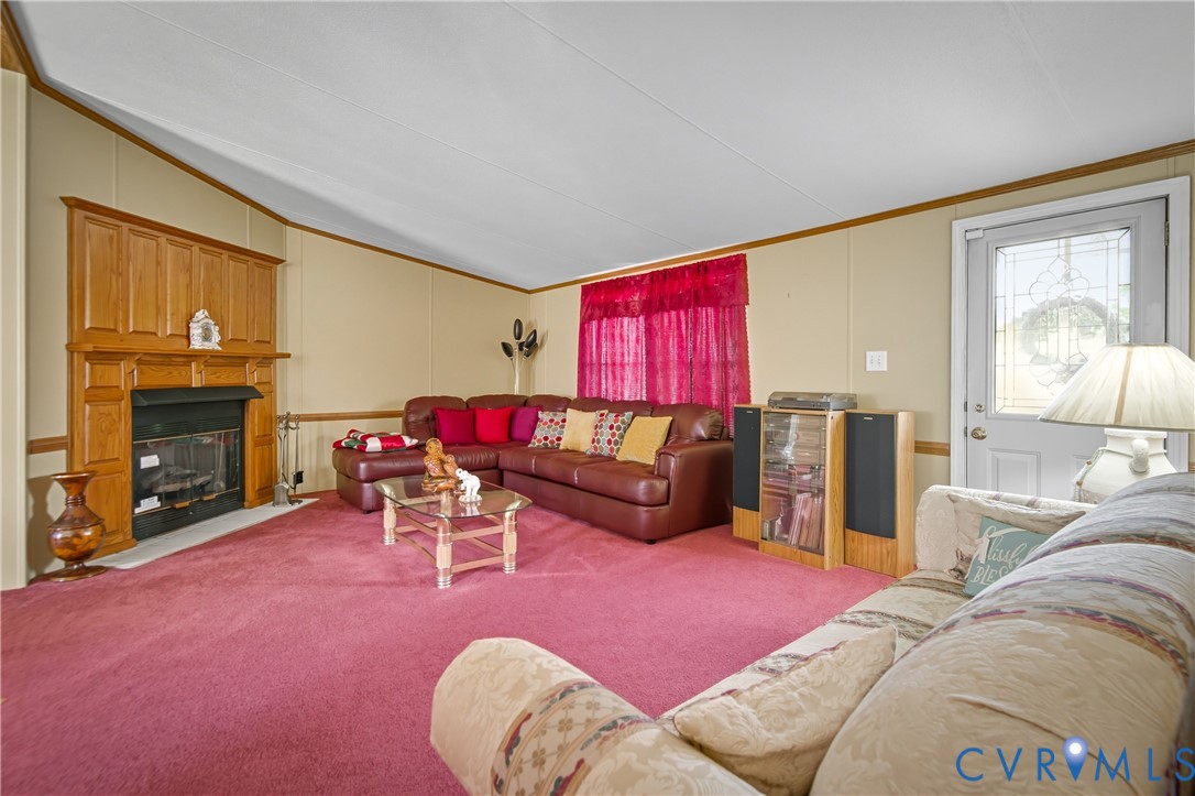23344 Booth Road Stony Creek, VA 23882 - Photo 6 of 45 a living room with furniture a fireplace