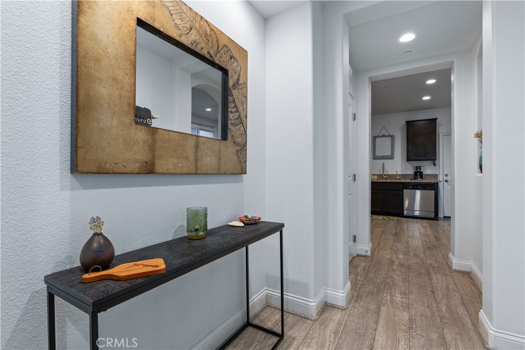 9354 Riberena Circle Atascadero, CA 93422 - Photo 6 of 47 a kitchen with stainless steel appliances granite countertop a sink and a stove with wooden floor
