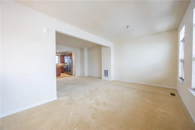 an empty room with an empty space and a window