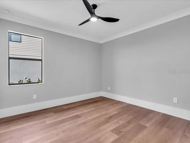 a view of swimming pool with a lounge chairs