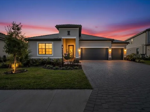 an aerial view of a house with a swimming pool yard and outdoor seating