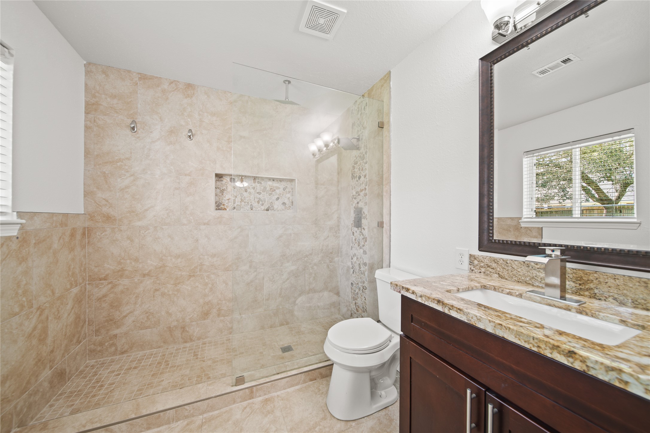 303 Rachael Lane Friendswood, TX 77546 - Photo 8 of 15 View of the master bathroom, nice stand up shower with double shower heads.
