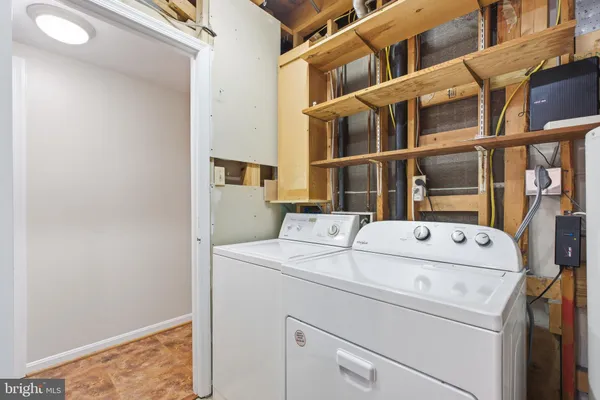 a view of a patio with a table and chairs