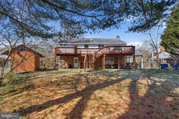 a front view of a building with a garden