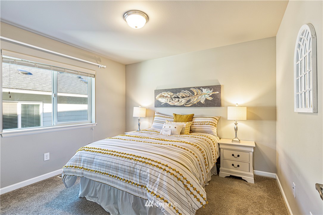 4411 236th Place Southeast Bothell, WA 98021 - Photo 19 of 31 a bedroom with a bed and a window