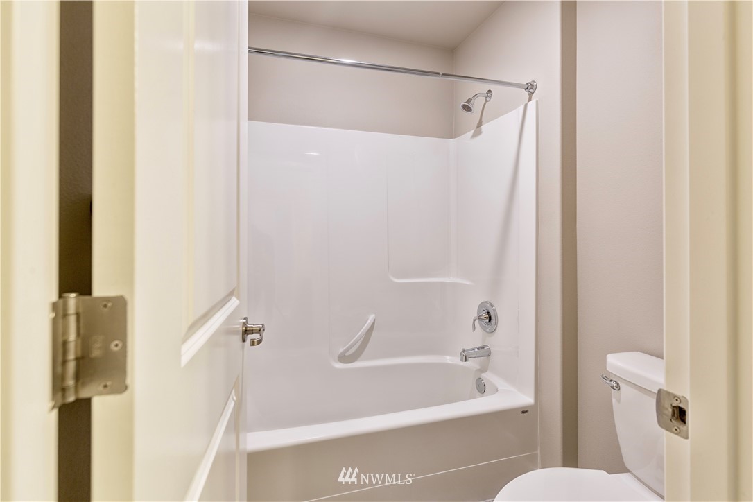 4411 236th Place Southeast Bothell, WA 98021 - Photo 21 of 31 a bathroom with a bathtub and a shower