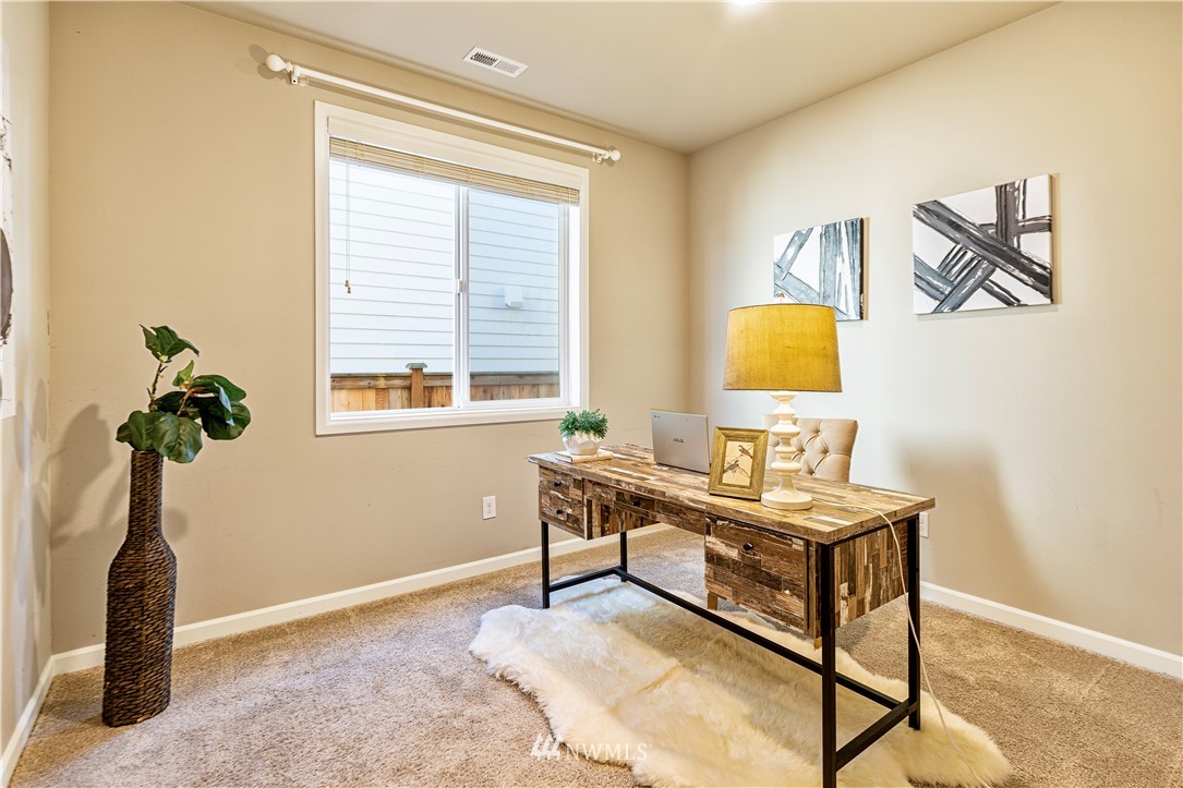 4411 236th Place Southeast Bothell, WA 98021 - Photo 22 of 31 a bedroom with a bed and a window