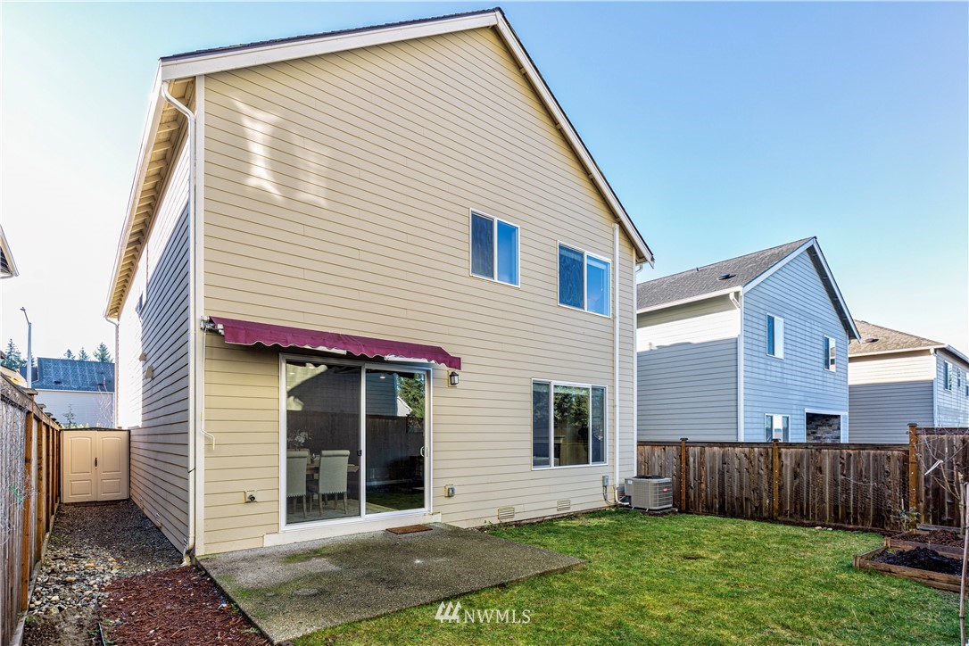 4411 236th Place Southeast Bothell, WA 98021 - Photo 24 of 31 a view of a house with a yard