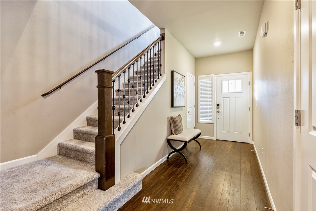 4411 236th Place Southeast Bothell, WA 98021 - Photo 3 of 31 a view of entryway with wooden floor and stairs