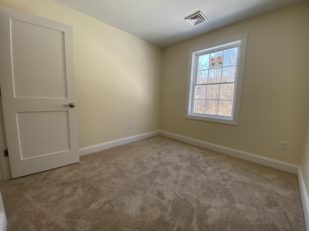 855 County Street, Unit 2 Attleboro, MA 02703 - Photo 20 of 27 an empty room with windows