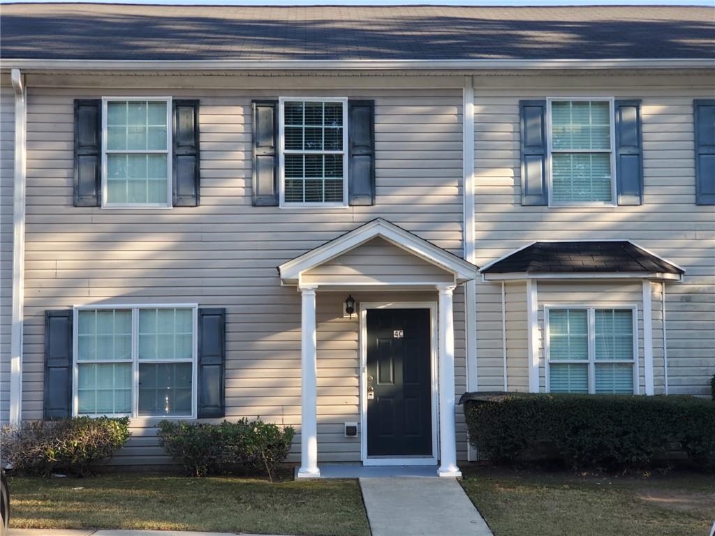 990 Harbins Road Northwest, Unit 4C Norcross, GA 30093 - Photo 1 of 1 a front view of a house with garden