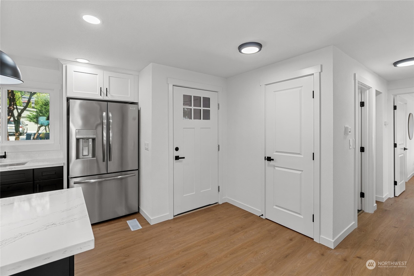 1256 Birch Street Edmonds, WA 98020 - Photo 12 of 37 a metallic refrigerator freezer sitting in a kitchen