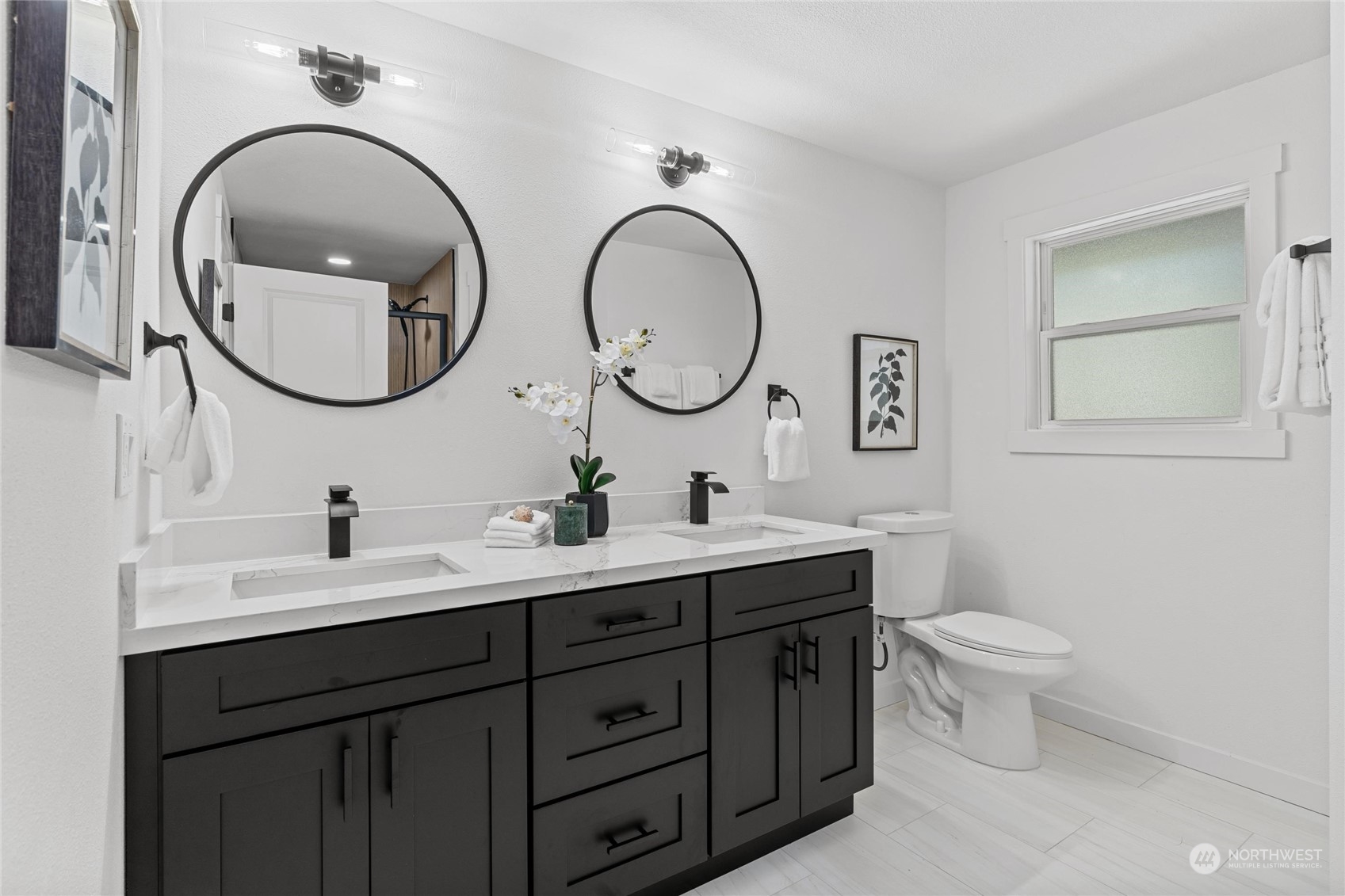 1256 Birch Street Edmonds, WA 98020 - Photo 17 of 37 a bathroom with a toilet a sink and a mirror