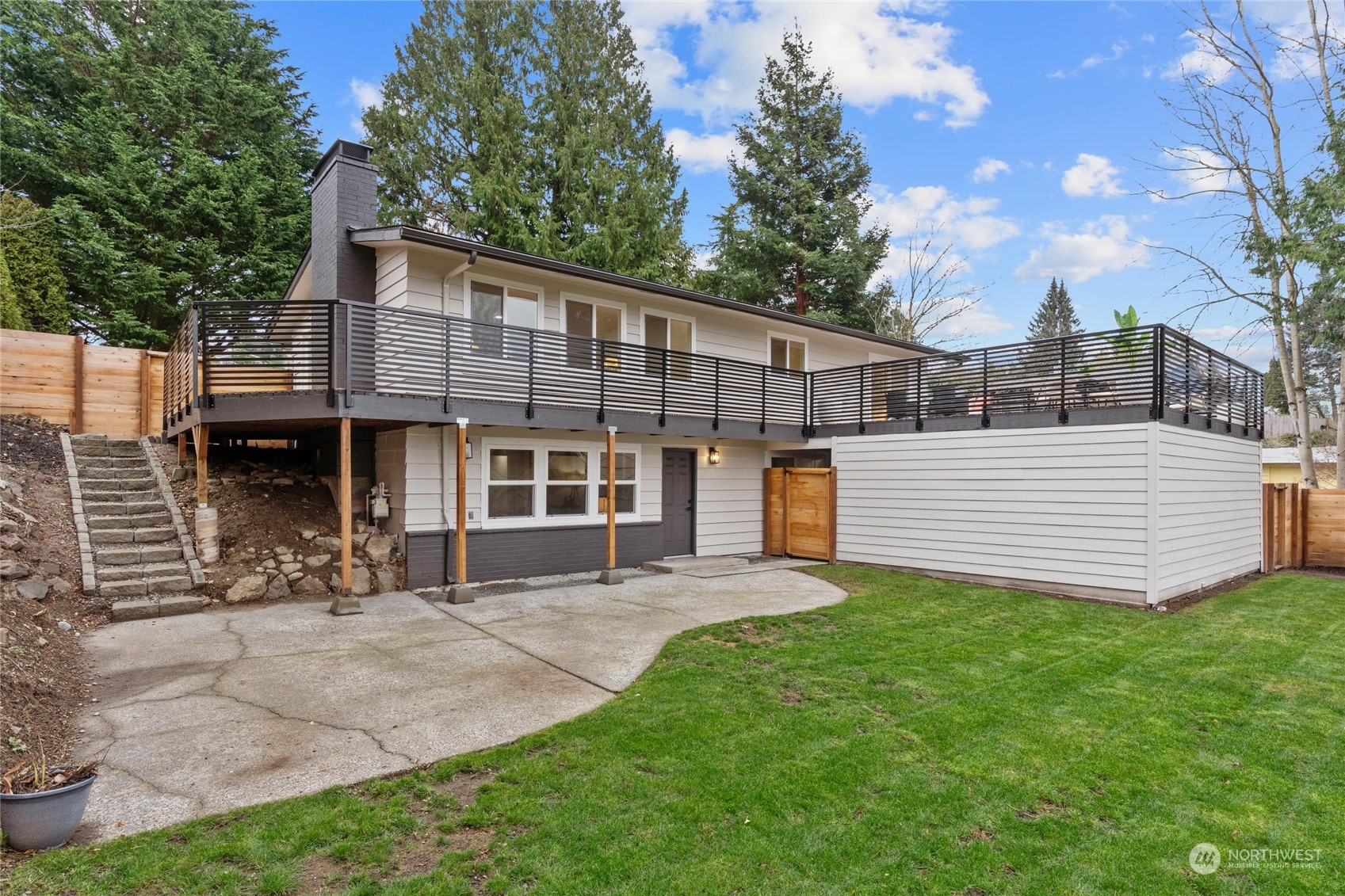 1256 Birch Street Edmonds, WA 98020 - Photo 26 of 37 a view of a house with a yard and sitting area