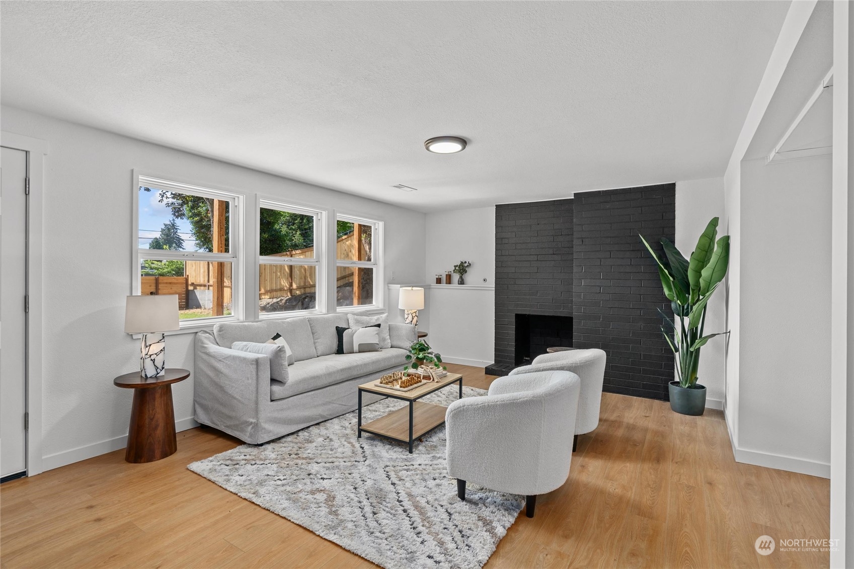 1256 Birch Street Edmonds, WA 98020 - Photo 27 of 37 a living room with furniture and a fireplace