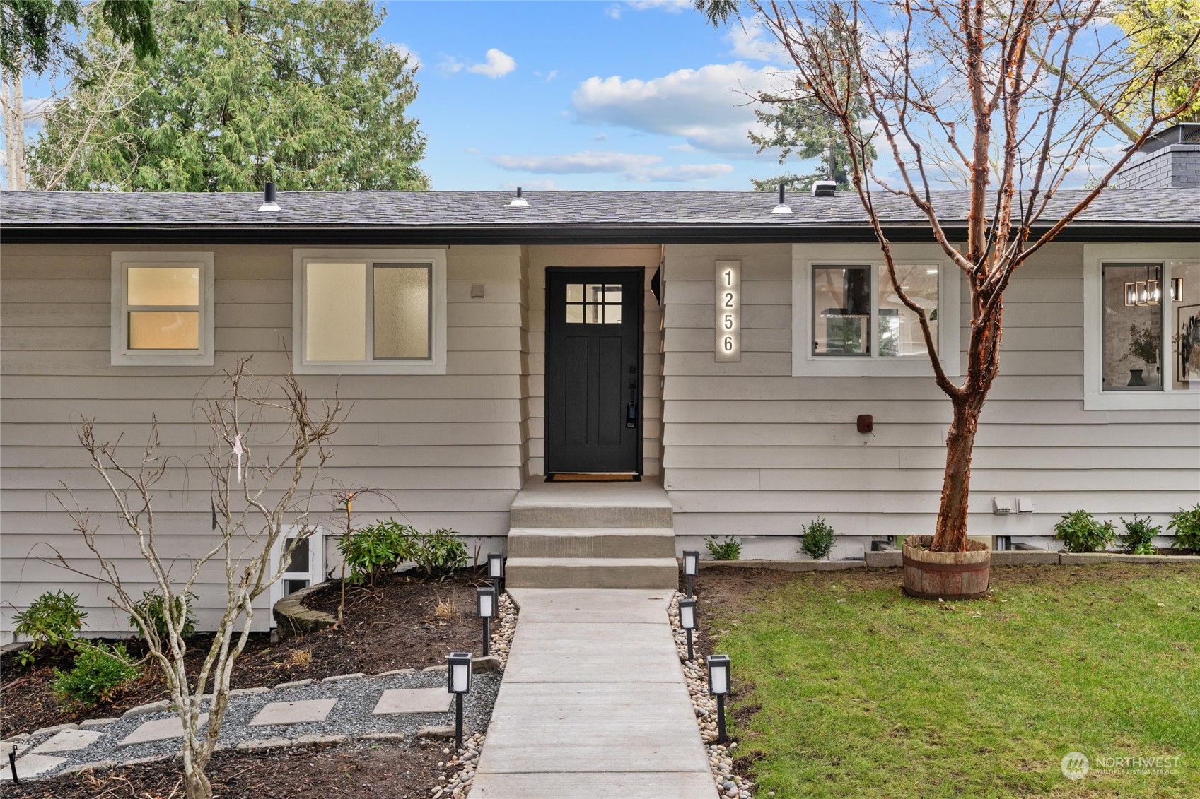 1256 Birch Street Edmonds, WA 98020 - Photo 3 of 37 a front view of a house with garden