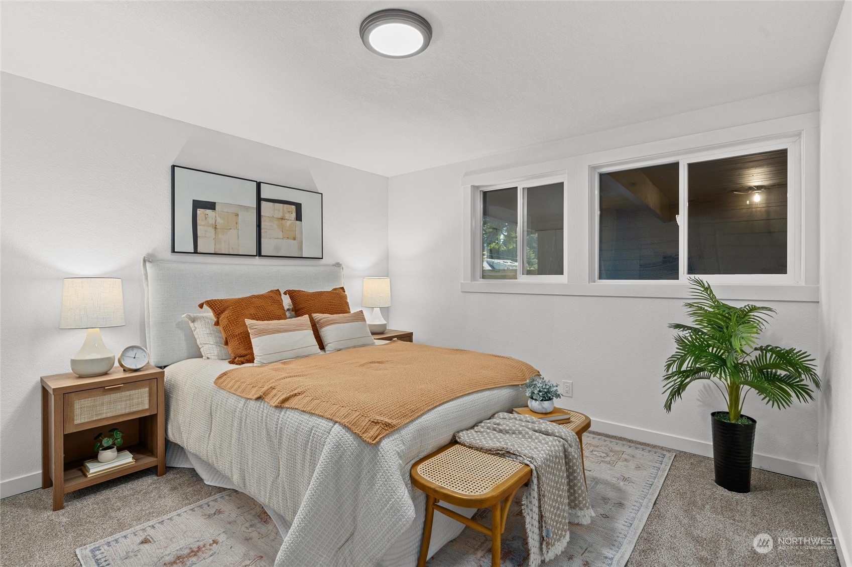 1256 Birch Street Edmonds, WA 98020 - Photo 33 of 37 a bedroom with a bed and a potted plant