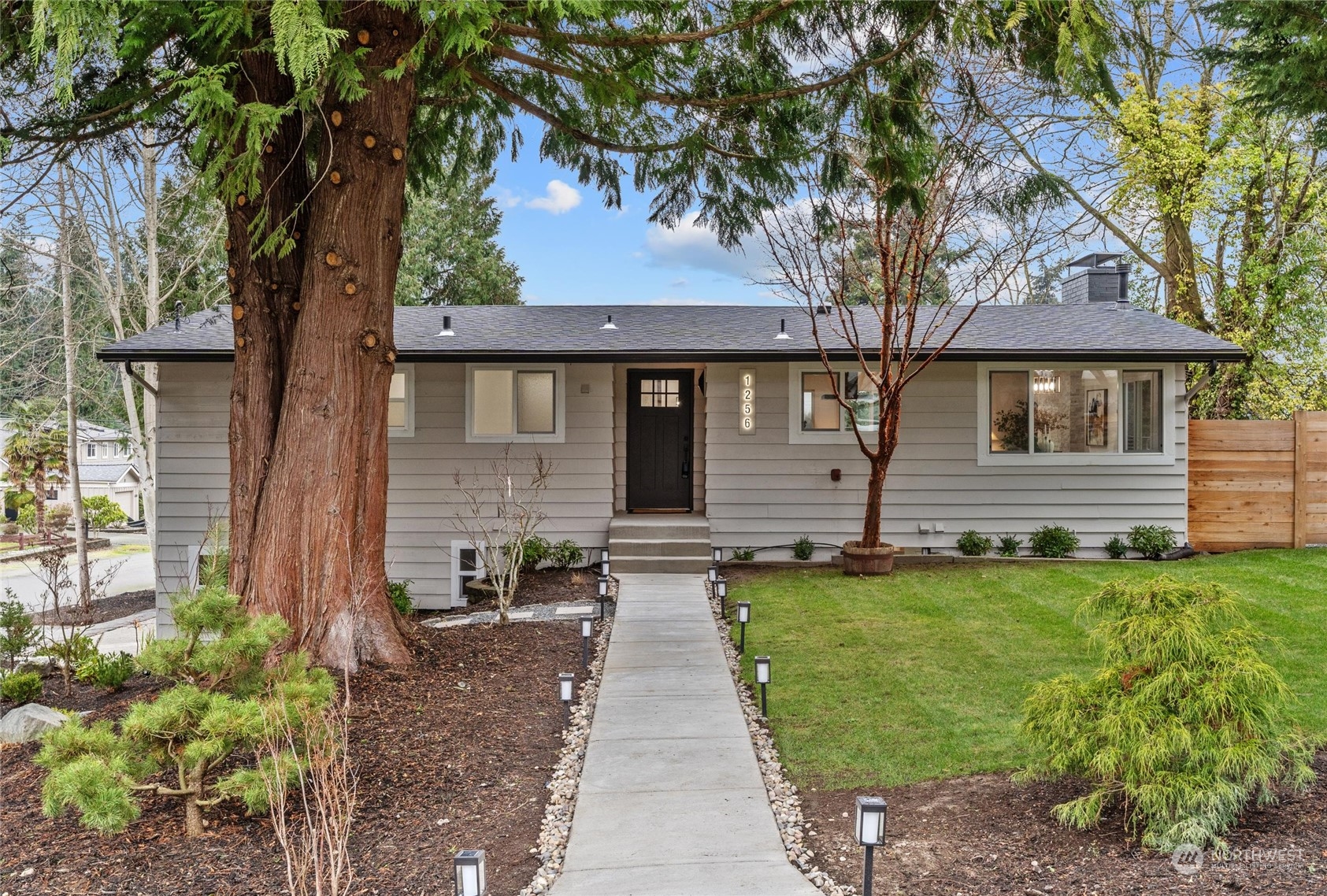1256 Birch Street Edmonds, WA 98020 - Photo 37 of 37 a front view of a house with a garden and yard