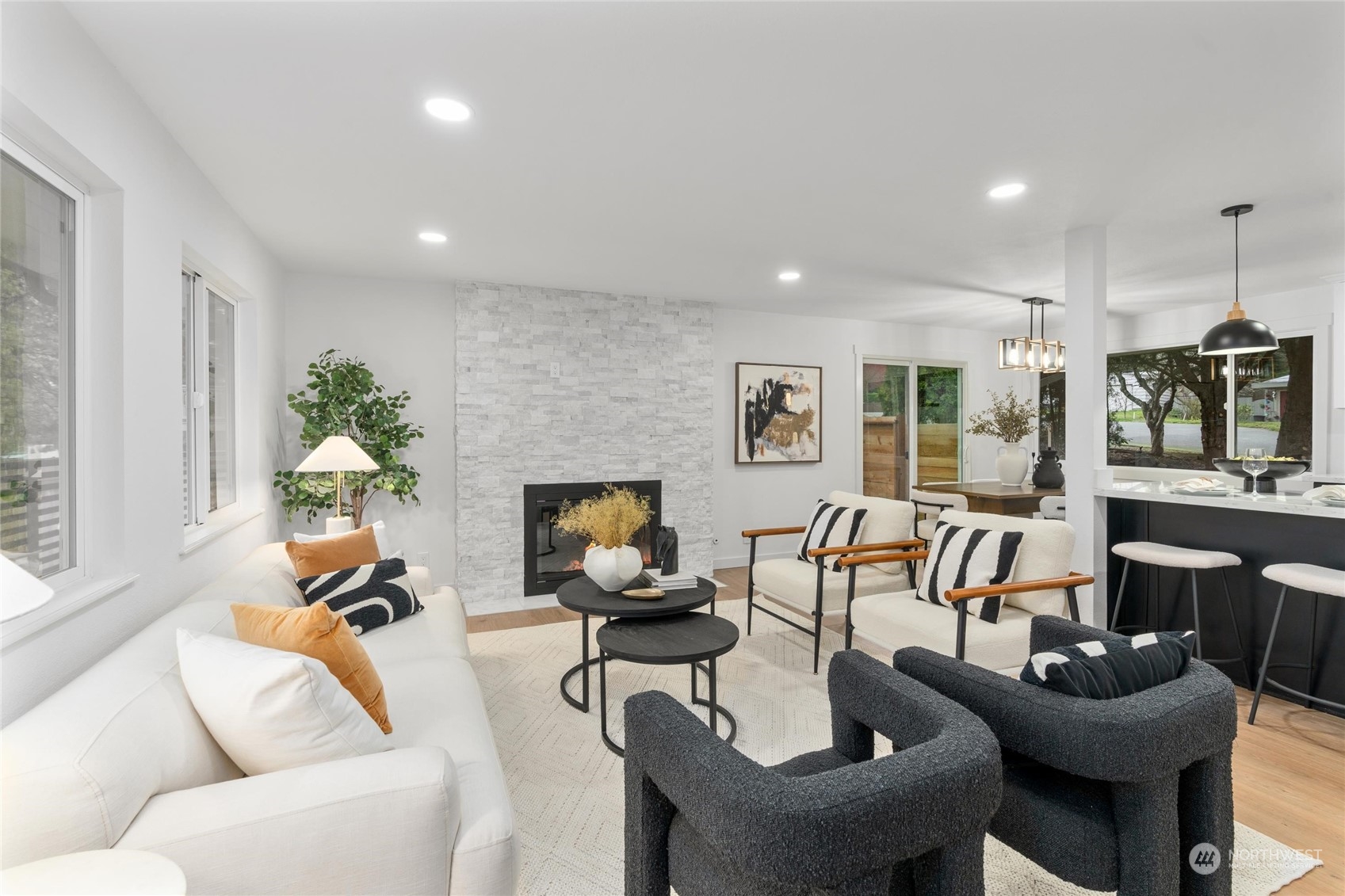 1256 Birch Street Edmonds, WA 98020 - Photo 10 of 37 a living room with furniture a fireplace and a flat screen tv