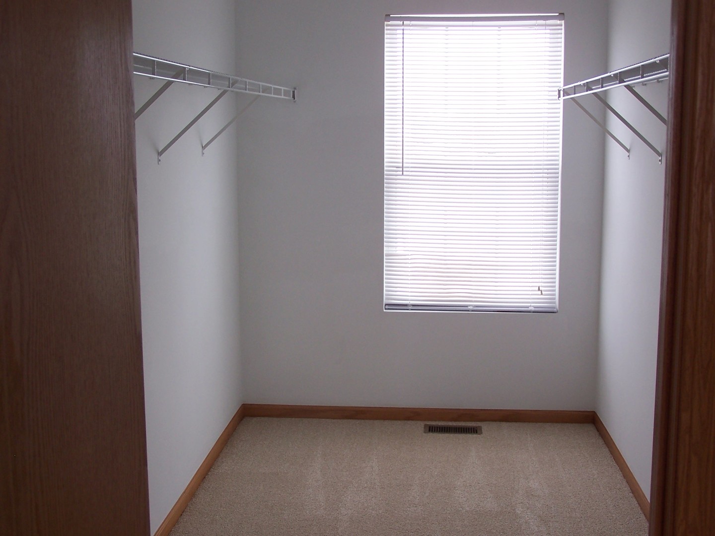 25216 Spring Street Manhattan, IL 60442 - Photo 8 of 21 a view of an empty room with a window